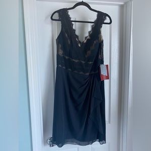Beautiful, little black dress, with lace accents. Size 14